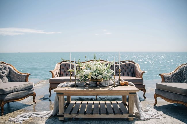 Outdoor wedding lounge against the ocean by Beso Events Chicago